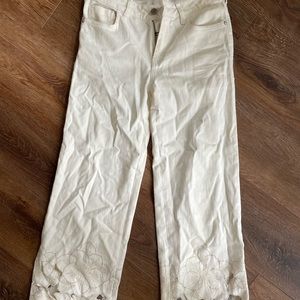 White Anthropologie jeans. With cute flower detail
